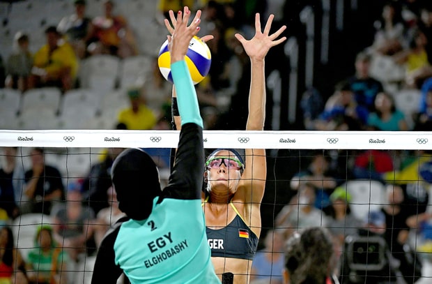 Egypt's Doaa Elghobashy (left) vies with Germany's Kira Walkenhorst during the women's beach volleyball